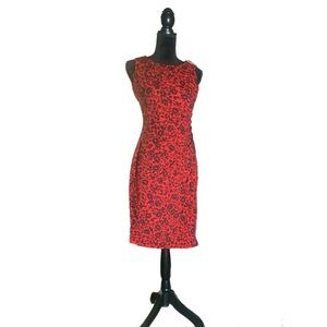 Beautiful and sophisticated tight red dress with black flowers.